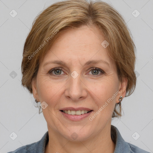 Joyful white adult female with medium  brown hair and grey eyes