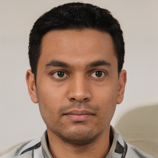 Neutral latino young-adult male with short  black hair and brown eyes