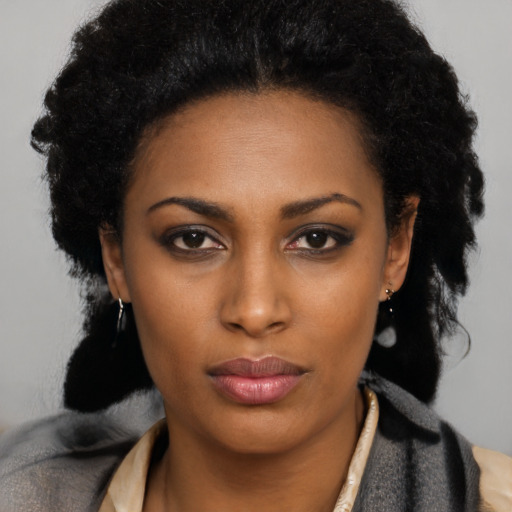 Neutral black young-adult female with long  black hair and brown eyes