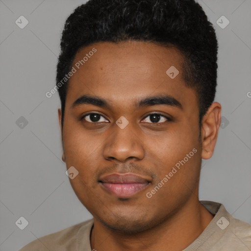 Joyful black young-adult male with short  brown hair and brown eyes