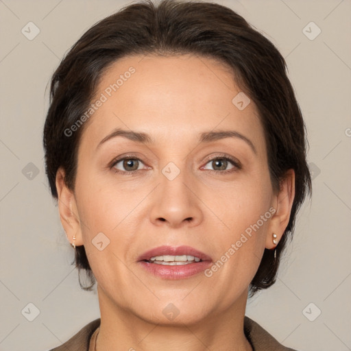 Joyful white adult female with medium  brown hair and brown eyes