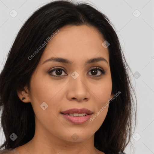 Joyful latino young-adult female with long  brown hair and brown eyes