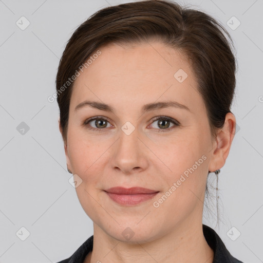 Joyful white adult female with short  brown hair and brown eyes