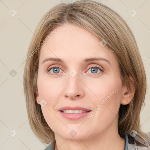 Joyful white young-adult female with medium  brown hair and blue eyes