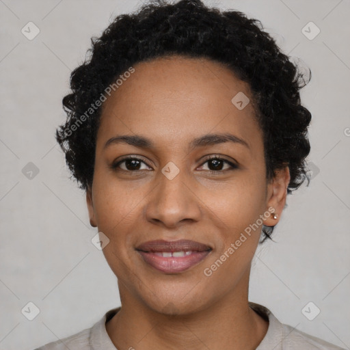 Joyful black young-adult female with short  black hair and brown eyes