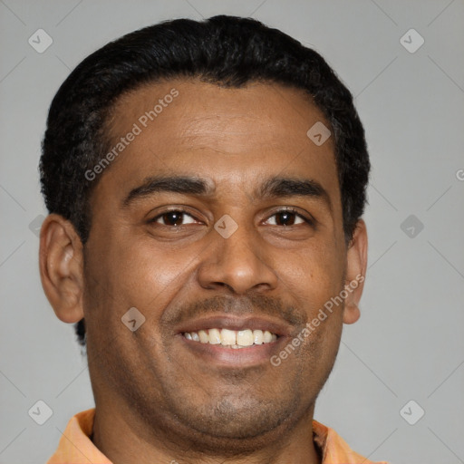 Joyful latino young-adult male with short  brown hair and brown eyes