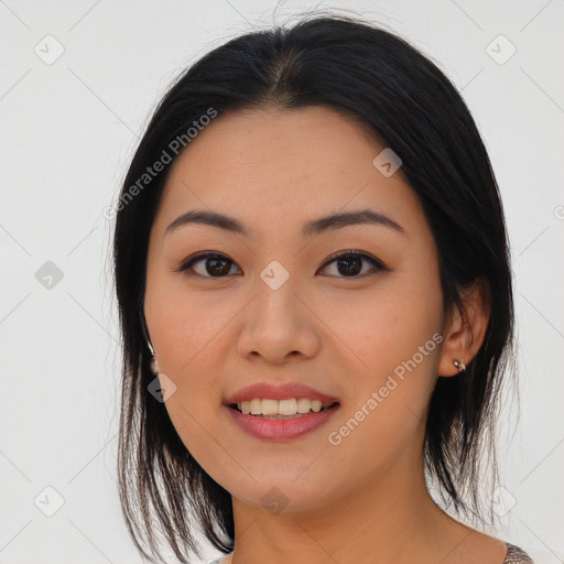 Joyful asian young-adult female with medium  black hair and brown eyes