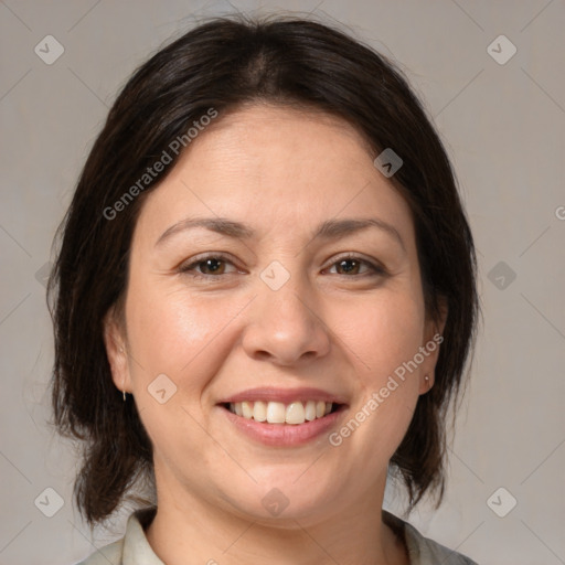 Joyful white adult female with medium  brown hair and brown eyes