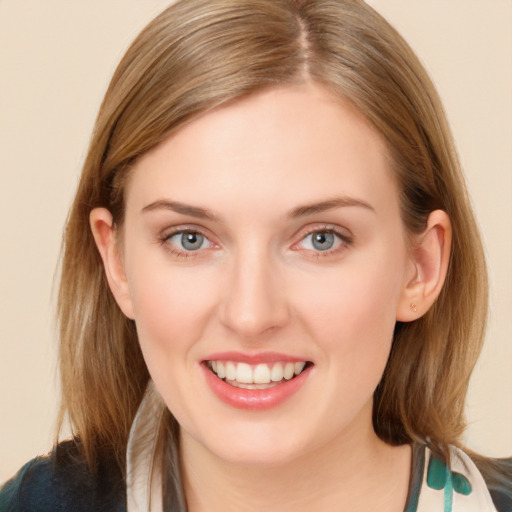 Joyful white young-adult female with long  brown hair and blue eyes