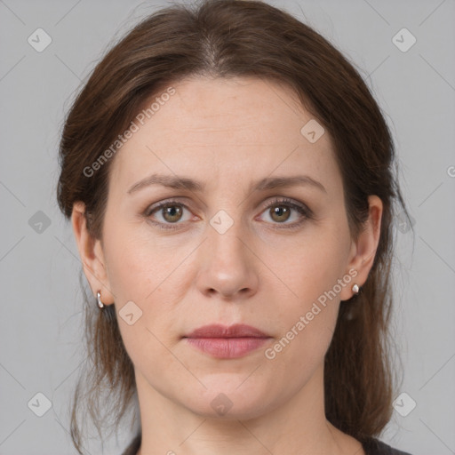 Joyful white young-adult female with medium  brown hair and grey eyes