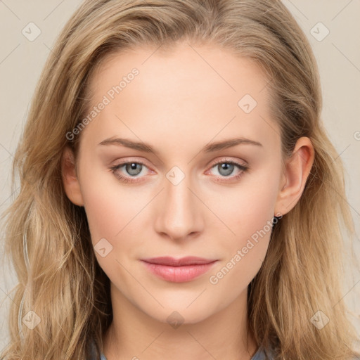 Joyful white young-adult female with long  brown hair and blue eyes