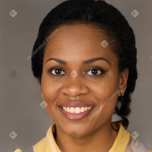 Joyful black young-adult female with medium  black hair and brown eyes