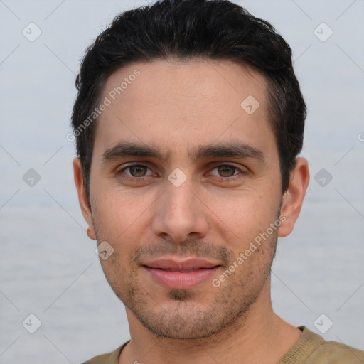 Joyful white young-adult male with short  brown hair and brown eyes