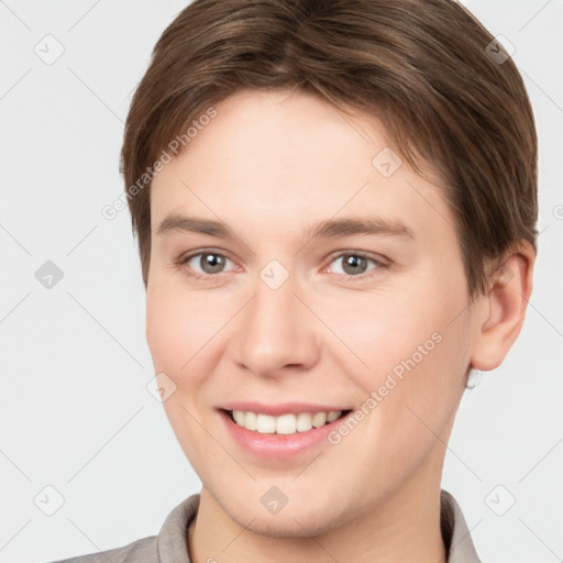 Joyful white young-adult female with short  brown hair and brown eyes