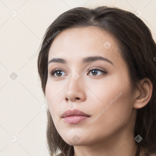 Neutral white young-adult female with long  brown hair and brown eyes