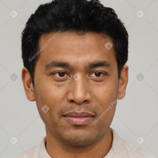 Joyful asian young-adult male with short  black hair and brown eyes