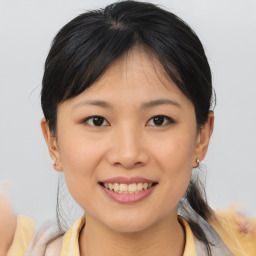 Joyful asian young-adult female with medium  brown hair and brown eyes