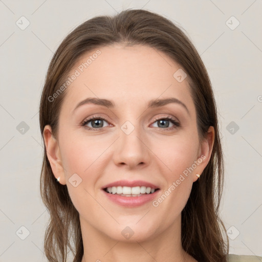 Joyful white young-adult female with long  brown hair and grey eyes