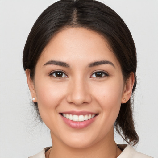 Joyful white young-adult female with medium  brown hair and brown eyes