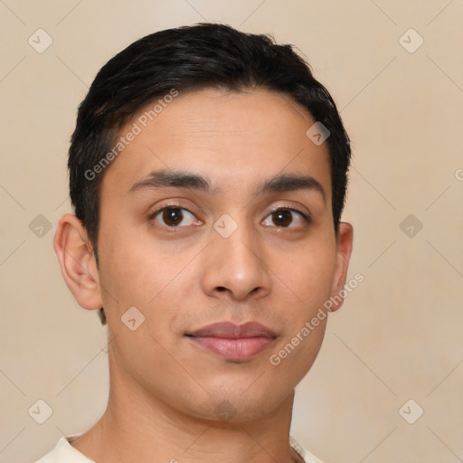 Joyful latino young-adult male with short  black hair and brown eyes