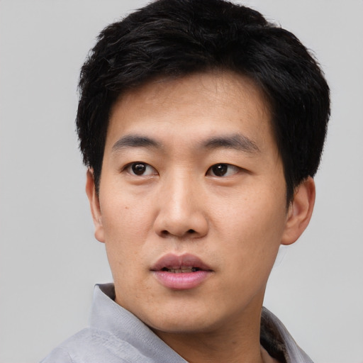 Neutral asian young-adult male with short  black hair and brown eyes