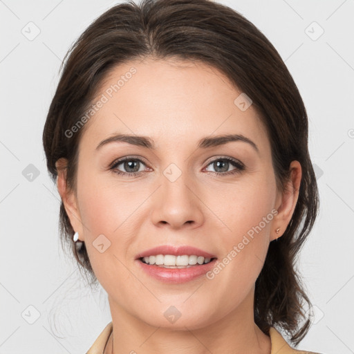 Joyful white young-adult female with medium  brown hair and brown eyes