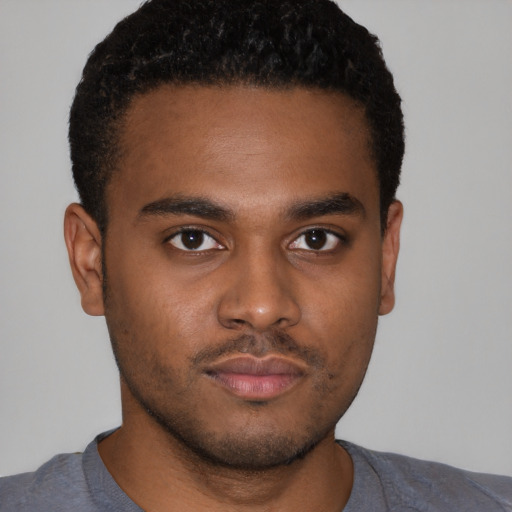 Neutral latino young-adult male with short  brown hair and brown eyes