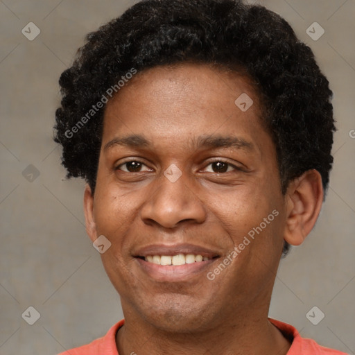 Joyful latino young-adult male with short  brown hair and brown eyes