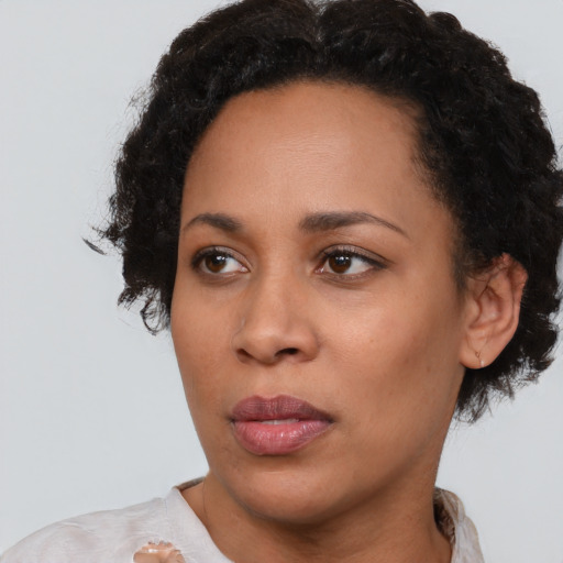 Neutral latino young-adult female with short  black hair and brown eyes