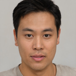 Neutral asian young-adult male with short  brown hair and brown eyes