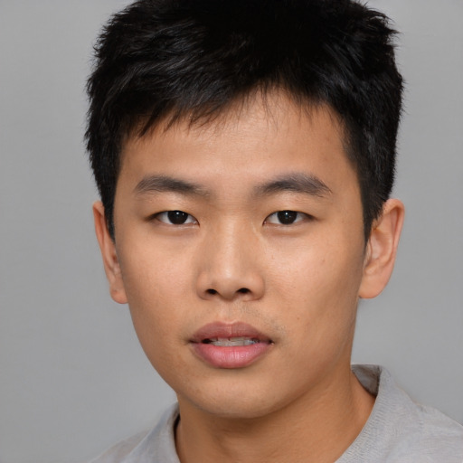 Neutral asian young-adult male with short  black hair and brown eyes