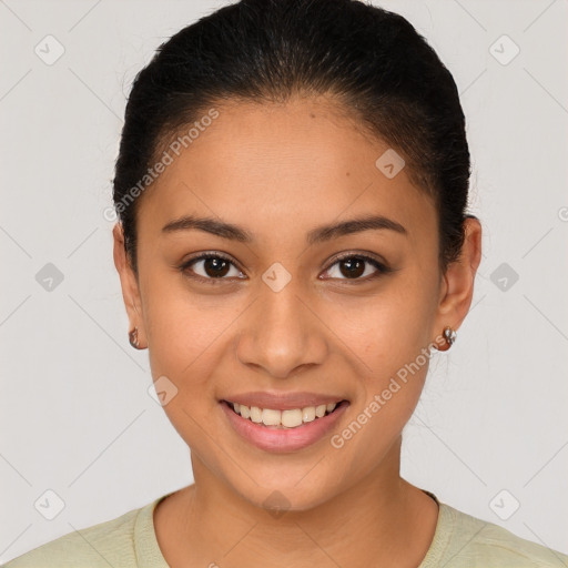 Joyful latino young-adult female with short  brown hair and brown eyes