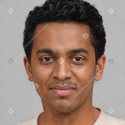 Joyful black young-adult male with short  black hair and brown eyes