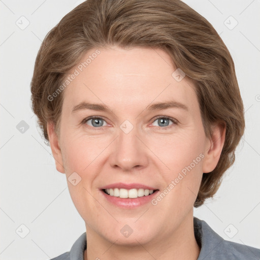 Joyful white adult female with short  brown hair and grey eyes