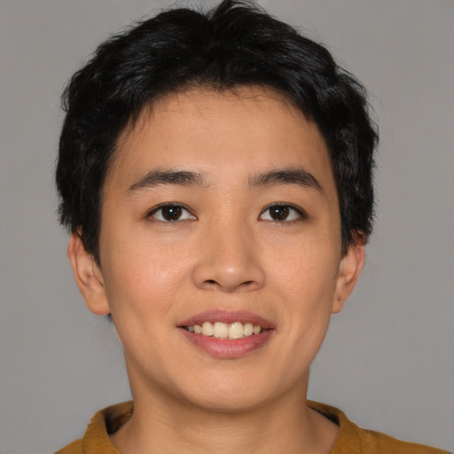 Joyful asian young-adult male with short  brown hair and brown eyes
