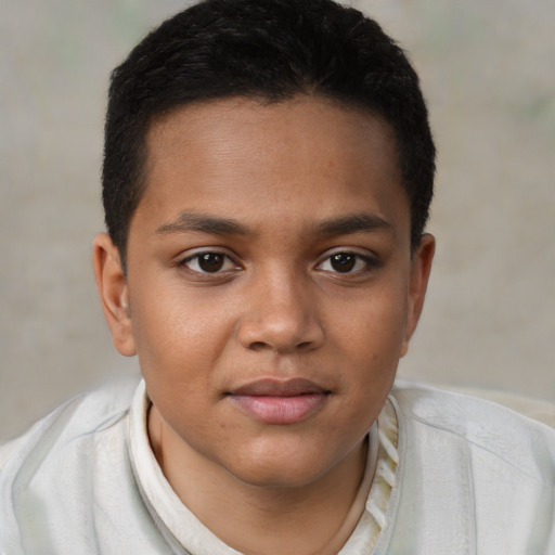 Joyful black child male with short  brown hair and brown eyes