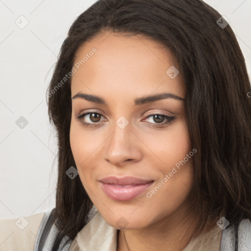 Joyful latino young-adult female with long  brown hair and brown eyes