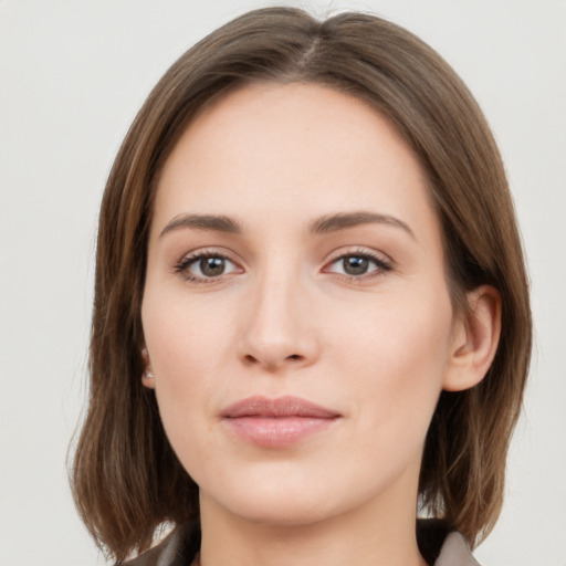 Neutral white young-adult female with medium  brown hair and grey eyes