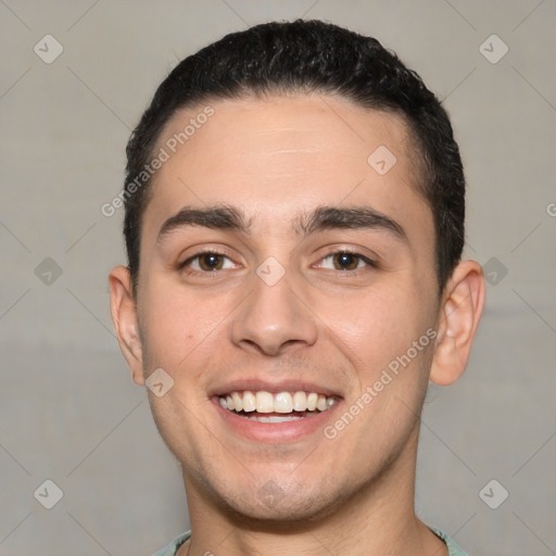 Joyful white young-adult male with short  black hair and brown eyes