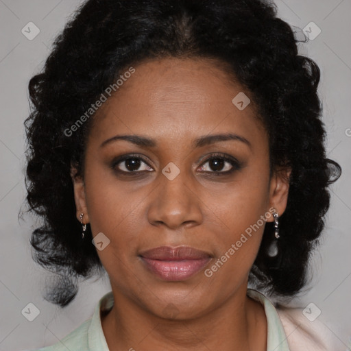 Joyful black adult female with medium  brown hair and brown eyes