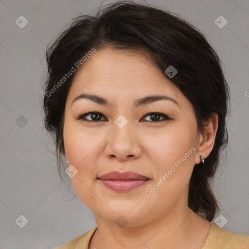 Joyful asian adult female with medium  brown hair and brown eyes