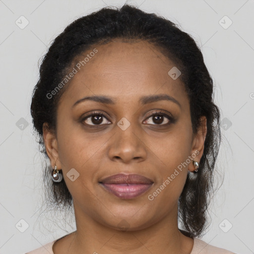 Joyful black young-adult female with long  brown hair and brown eyes