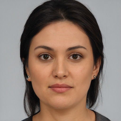 Joyful white young-adult female with medium  brown hair and brown eyes