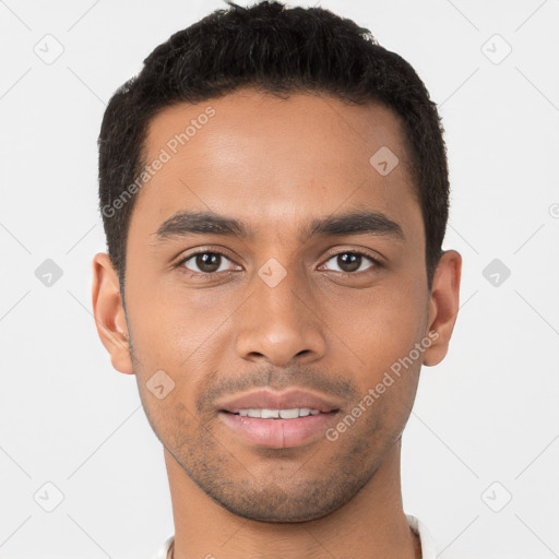 Joyful latino young-adult male with short  brown hair and brown eyes