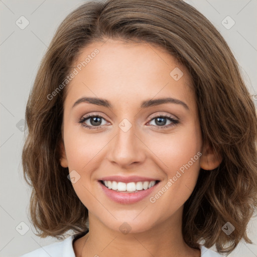 Joyful white young-adult female with long  brown hair and green eyes