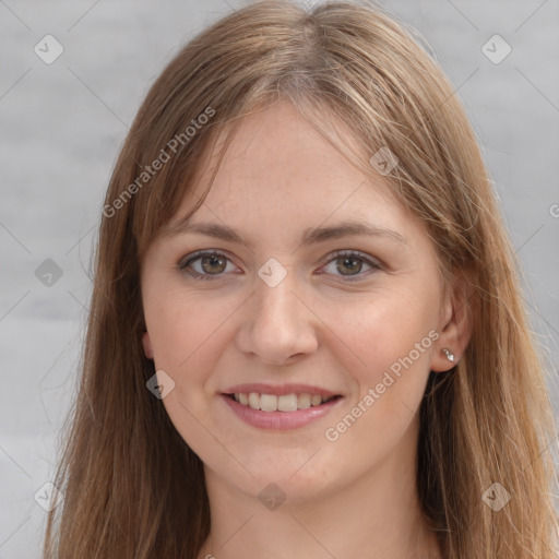 Joyful white young-adult female with long  brown hair and grey eyes