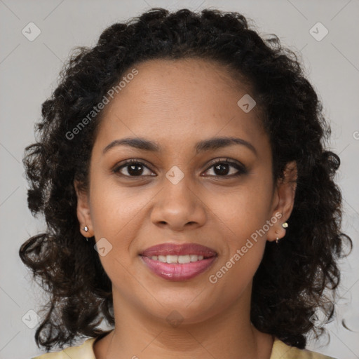 Joyful black young-adult female with long  brown hair and brown eyes