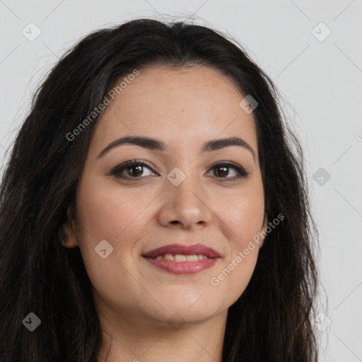 Joyful latino young-adult female with long  brown hair and brown eyes