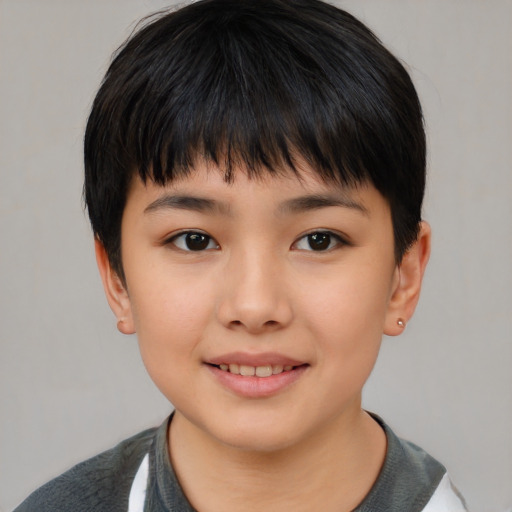 Joyful asian child female with short  brown hair and brown eyes