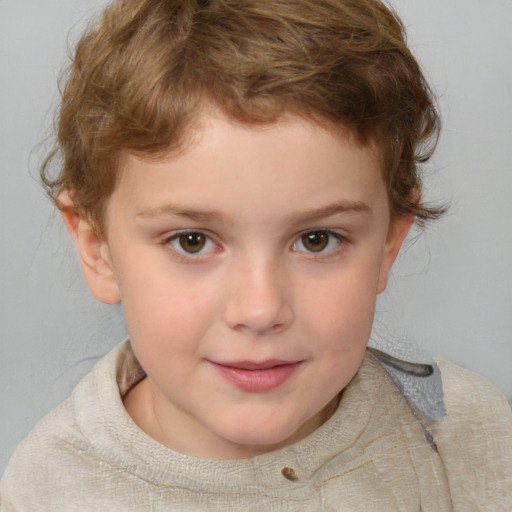 Joyful white child male with short  brown hair and blue eyes